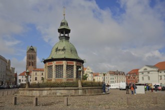 Renaissance water art with dome and St Mary's Church tower, landmark, market square, Wismar,