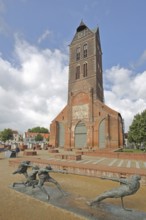 Sculpture Tug-of-War by Karl-Henning Seemann 1987 and Gothic, St Mary's Church tower without nave,