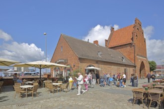 Historic water gate as part of the former town fortifications, street pub, restaurant, ice cream