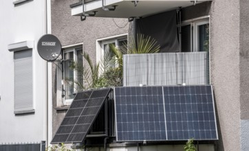 Residential building with photovoltaic modules on the balcony, balcony power plant, North