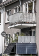 Residential building with photovoltaic modules on the balcony, balcony power plant, North