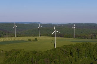 Landscape with wind turbines and green fields under a blue sky, near Westerheim, Swabian Alb,