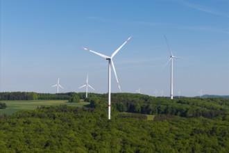Field with several wind turbines under a bright blue sky, near Westerheim, Swabian Alb,