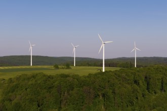 Green landscape with wind turbines, surrounded by forest, near Westerheim, Swabian Alb,