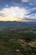 Panorama of Sunset over Mountains and Coniston Water from drone, Lake District National Park,
