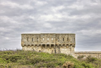 Old fort tower at Pointe du Toulinguet with a cloudy sky, Camaret-sur-Mer, Crozon peninsula,