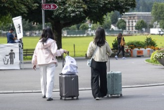 Tourists with luggage, Interlaken, Bern, Switzerland