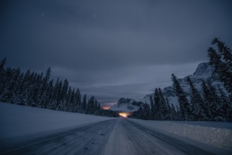 Starry sky during a winter road trip on the Icefields Parkway with lots of snow and ice, Banff