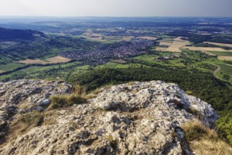 View from the Breitenstein rock plateau over extensive fields and villages as far as the horizon,