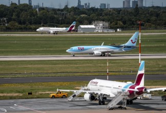Düsseldorf Airport, Eurowings Airbus aircraft on the apron, TUI Boeing 737-800 on take-off,