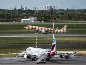 Düsseldorf Airport, Eurowings Airbus aircraft on the apron, Condor Airbus A321-200 taking off, in