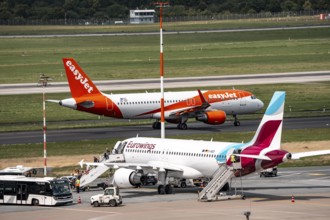 Düsseldorf Airport, Eurowings Airbus aircraft on the apron, EasyJet Airbus A320-200 taxiing for