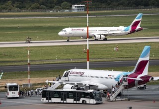 Düsseldorf Airport, Eurowings aircraft taking off, Eurowings Airbus on the apron, passengers
