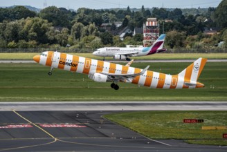Düsseldorf Airport, Condor Airbus A321-211 on take-off, Eurowings Airbus aircraft after landing,