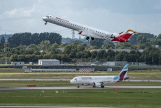 Düsseldorf Airport, Iberia Regional Mitsubishi CRJ-1000, Air Nostrum, on take-off, Eurowings Airbus