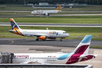 Düsseldorf Airport, Eurowings Airbus aircraft on the apron, HiSky Europe Airbus A320-200 on