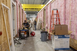 Romulus, Michigan - Workers build apartments in Ginosko Modular 's factory using modular