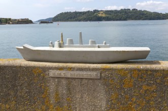 Steel model of HMS Invincible navy ship on seafront wall, city of Plymouth, Devon, England, UK