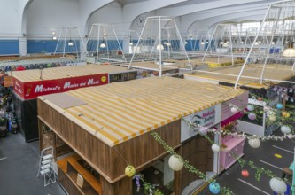 Raised view over roofs of market stalls in Market Building or Pannier Market, city of Plymouth,