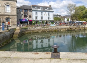 People sitting outside The Three Crowns pub quayside harbour, The Barbican, Plymouth, Devon,