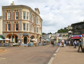 Offshore bar and restaurant, people walking near quayside shops, Vaughan Parade, Torquay, Devon,