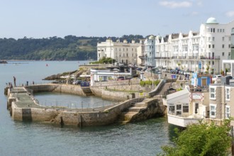 Seafront coastline waterfront, city of Plymouth, Devon, England, UK view west to Drake's Island