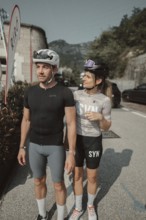 Woman and man riding racing bikes in Italy on Lake Garda