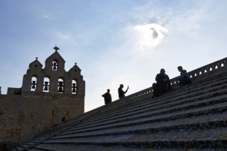 Viewing terrace of the church Notre-Dame-de-la-Mer, tourists on the roof of the fortified church,