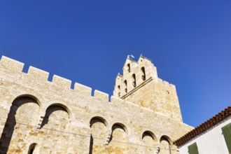 Church of Notre-Dame-de-la-Mer in front of a blue sky, Saintes-Maries-de-la-Mer, Camargue, France