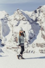 Woman in wintry surroundings in the Engadine in Switzerland