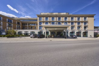 Hotel Edelweiss, building, roofed entrance area, blue sky, cumulus clouds, cirrostratus clouds,