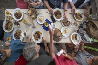 Meal in a pub in Middle Franconia, Franconian Obazda, dressed cheese, sausages with sauerkraut and