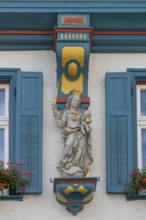 Statue of the Virgin Mary on a house, Biberach an der Riß, Baden-Württemberg, Germany