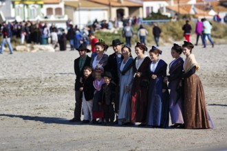 Group of pilgrims in traditional costumes, sandy beach, pilgrimage, Saintes-Maries-de-la-Mer,