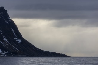 Bad weather, rain, dark clouds, mountain range, Gravnesodden, Spitsbergen, Svalbard