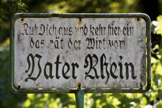 Old sign with the rhyme Ruh dich aus und kehr hier ein das rät der Wirt vom Vater Rhein,