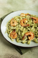 Tagliatelle with spinach, in cream sauce, with shrimp, homemade, no people