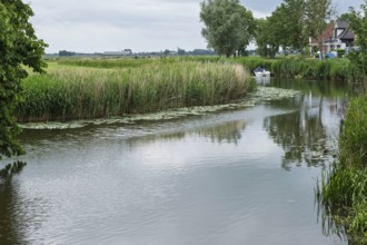 Damsterdiep canal in the village of ten Post, province of Groningen, Netherlands