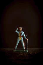 Intricate Native American Indian figure toy figurine in a blue uniform confidently salutes while