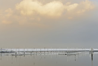 Winter day, onset of winter, snow on the jetties in the marina, North Sea, Norddeich, Lower Saxony,
