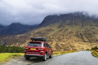 Off road 4x4 car with roof tent on Fairy Pools and Waterfalls, Glen Brittle, Black Cuillin, Isle of
