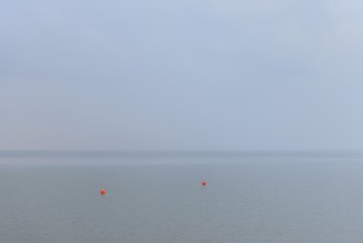 North Sea, two red buoys in the Wadden Sea, Norddeich, Lower Saxony, Germany