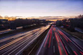 Motorway A96 at dusk and night with coloured lanes of moving cars. Munich, Bavaria, Germany