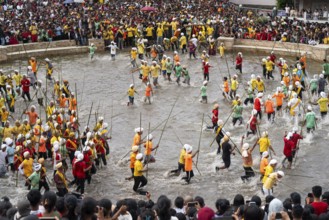 People from the Pnar community march in a circle as they celebrate an event organized to mark the