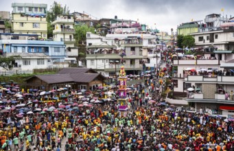 People from the Pnar community march in a circle around a Rot as they celebrate an event organised
