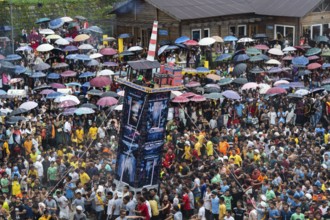 People from the Pnar community move around a Rot themed Coal Factory as they celebrate an event