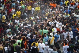 JOWAI, INDIA - JULY 14: People from the Pnar community perform rituals as they carry a large log to