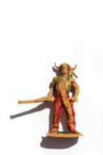 Detailed representation of a broken Native American Indian figure on a white background