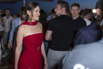 Hilary Swank walks through the crowd at the Remus Lifestyle Night on the rooftop terrace of the
