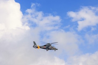 French navy helicopter flying in the sky, Bretagne, France